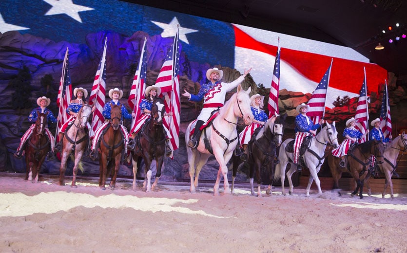 Dolly Parton's Stampede featuring 32 magnificent horses and skilled riders