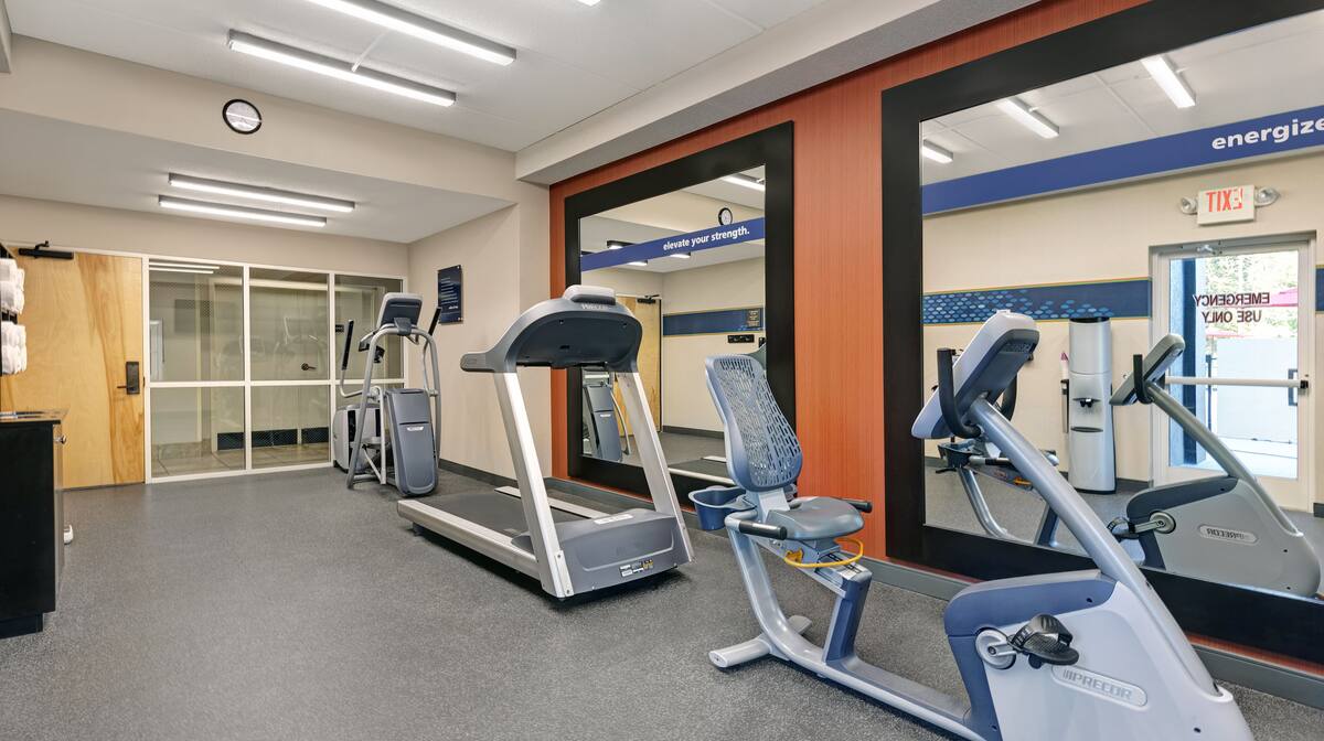 Fitness center with treadmill and weights